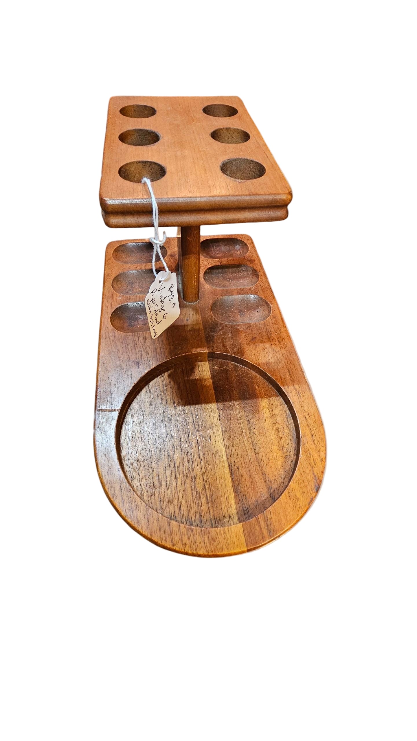 Wooden pipe holder with multiple compartments on a beige background