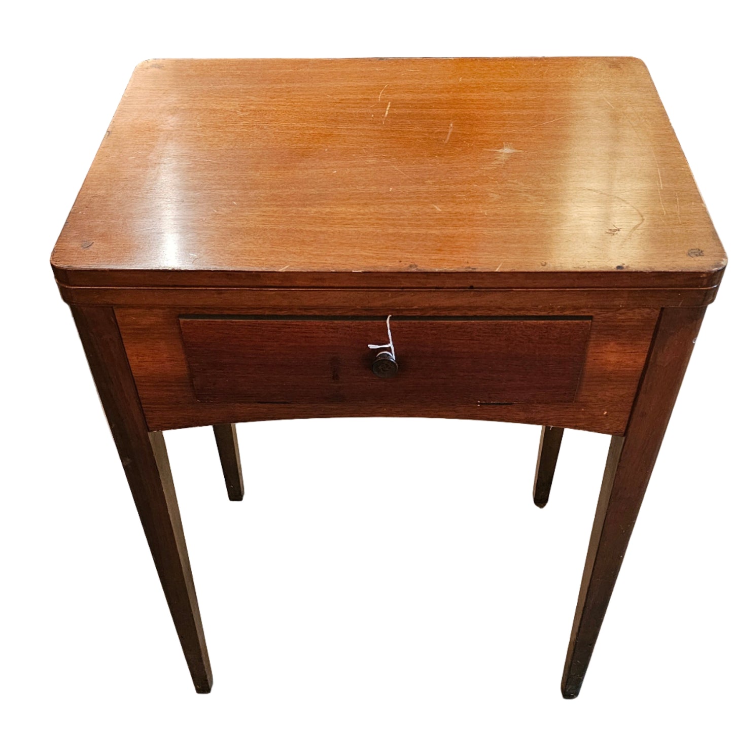 Vintage sewing machine on a wooden stand in an indoor setting