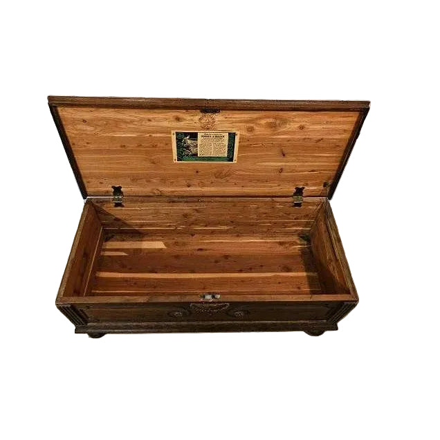 Wooden trunk with a visible brand label on a white background